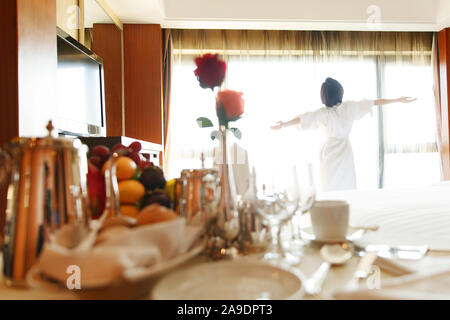 The young woman in a hotel room for coffee Stock Photo