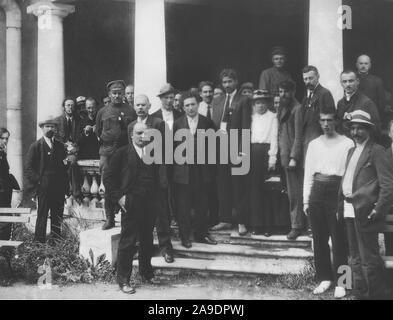 Delegates to the second congress of the Comintern at the Uritsky Palace in Petrograd. The recognized are: Lev Karakhan (second from left), Karl Radek (third, smoking), Nikolai Bukharin (fifth), Mikhail Lashevich (seventh uniform), Maxim Peshkov (Maxim Gorky's son) (behind the column), Maxim Gorky (ninth shaved), Vladimir Lenin (tenth, hands in pockets), Sergey Zorin (eleventh, with hat), Grigory Zinoviev (thirteenth, hands behind his back), Charles Shipman (Jesús Ramírez) (white shirt and tie), M.N. Roy (coat and tie), Maria Ulyanova (nineteenth, white blouse), Nicola Bombacci (with beard) and Stock Photo
