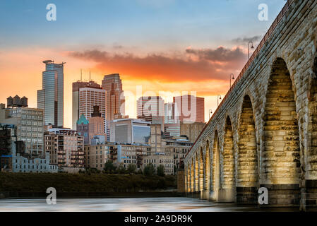 Stone Arch Bridge lights in Minneapolis at sunset Stock Photo