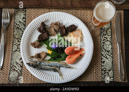 A taste of Greenland food selection at a local restaurant in Qaqortoq, Greenland called the Inbox Café - A Little Thai Corner. Stock Photo