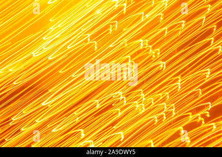 Futuristic blurred lights holiday monochrome background in yellow. Horizontal, soft focus Stock Photo