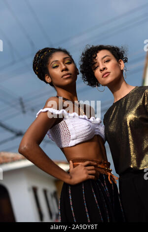 Two latin young women in the streets of Cali, Colombia Stock Photo