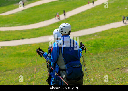 Tandem flight, paraglider pilot by the start in the Alpspitz area near Garmisch-Partenkirchen Stock Photo