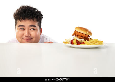 Small fat boy want to eat hamburgers Stock Photo