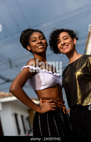 Two latin young women in the streets of Cali, Colombia Stock Photo