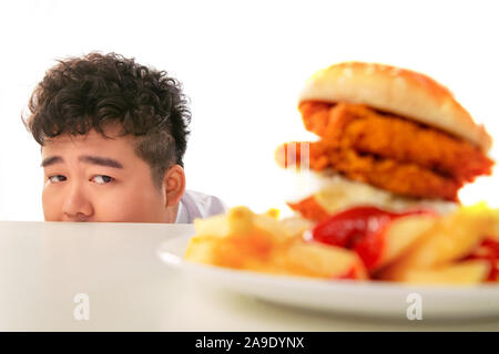 Small fat boy want to eat hamburgers Stock Photo