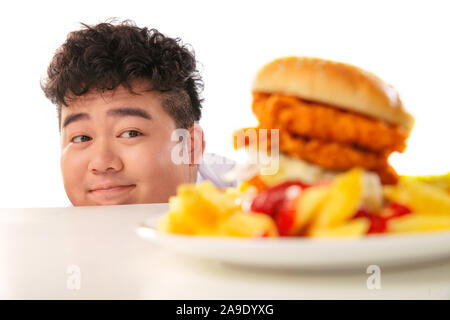 Small fat boy want to eat hamburgers Stock Photo