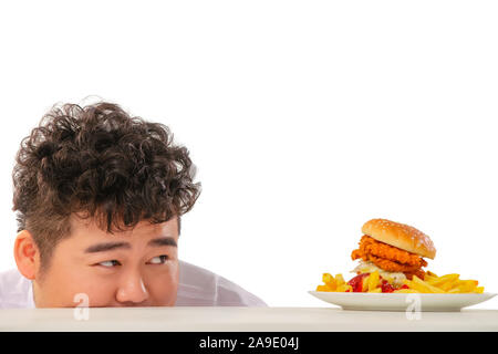 Small fat boy want to eat hamburgers Stock Photo