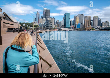 Sydney Harbour, skyline, tourist takes photos Stock Photo