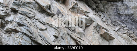 Close-up of abstract rock texture background with cracks and chips Stock Photo