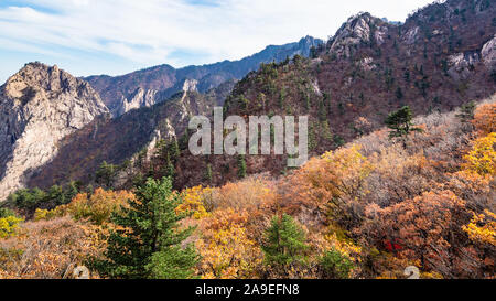 travel to South Korea - panoramic view of colorful mountain slope and rocks in Seoraksan National Park in South Korea in autumn Stock Photo