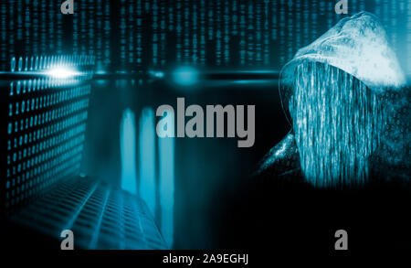 Faceless, anonymous computer hacker with hood Stock Photo