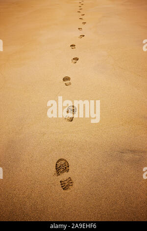 Shoe prints in the sand Stock Photo