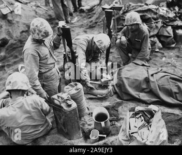 Wounded soldiers on Iwo Jima receive plasma to help recover from shock ...