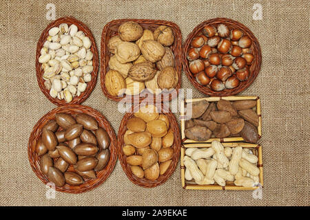 still life of edible seeds put in small baskets of different shapes Stock Photo