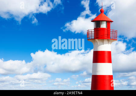 Red and white striped lighthouse Stock Photo