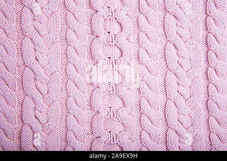 Knitted Fabric Texture. Pink Knitted Background. Modern sweater Stock Photo