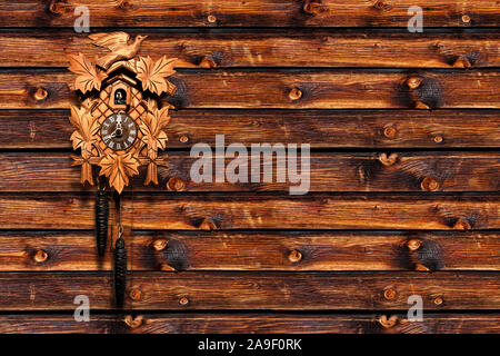 Cuckoo clock on wooden wall Stock Photo
