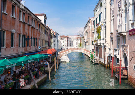 Venice, Italy - September 27, 2013: San Lorenzo Channel, canal, with bridges and cafeas and restaurants on sunny day Stock Photo