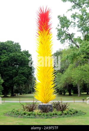 'Scarlet and Yellow Icicle Tower' by Dale Chihuly in Kew Gardens, Richmond, London, UK. Stock Photo