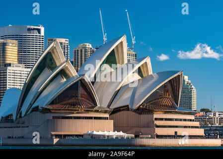 Sydney, Australia - July 23, 2016: Sydney Opera house close up with office buildings of Sydney Central Business District on the background. Circular Q Stock Photo