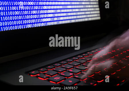 Programming a software on a notebook Stock Photo