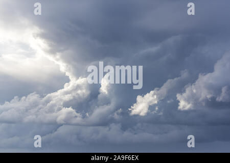 Stormy clouds with sunshine. Rainy weather background, cloudscape Stock Photo