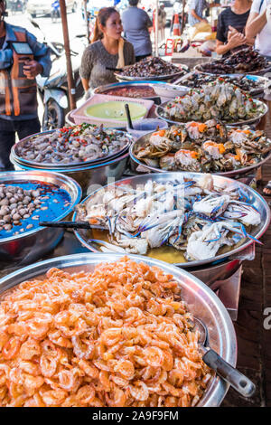 Bangkok, Thailand - September 25th 2018:  Street stall selling seafood on Yaowarat Road. Street food is everywhere in the area. Stock Photo