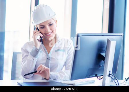 Talented Young Female Architectural Designer Draws Building Concept on a Graphics Tablet. Stock Photo