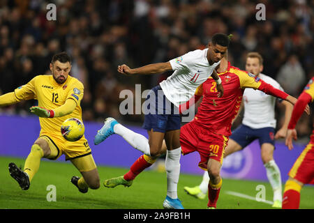 Marcus Rashford of England attempts a Back heel shot at goal but its blocked by Milan Mijatovic, the Montenegro goalkeeper. UEFA Euro 2020 qualifier, group A match, England v Montenegro at Wembley Stadium in London on Thursday 14th November 2019. EDITORIAL USE ONLY. this image may only be used for Editorial purposes. Editorial use only, license required for commercial use. No use in betting, games or a single club/league/player publications pic by Andrew Orchard/Andrew Orchard sports photography/Alamy Live news Stock Photo