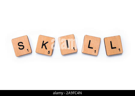 London, UK - June 12th 2019: The word SKILL, spelt with wooden letter tiles over a white background. Stock Photo