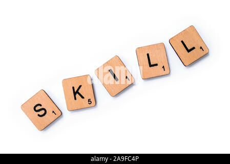 London, UK - June 12th 2019: The word SKILL, spelt with wooden letter tiles over a white background. Stock Photo