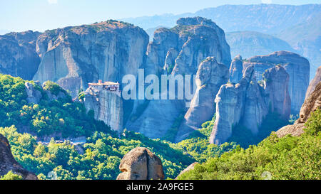 Panoramic view of the rocks of Meteora with The Monastery of Roussanou on the top of the cliff, Greece -  Greek landscape Stock Photo