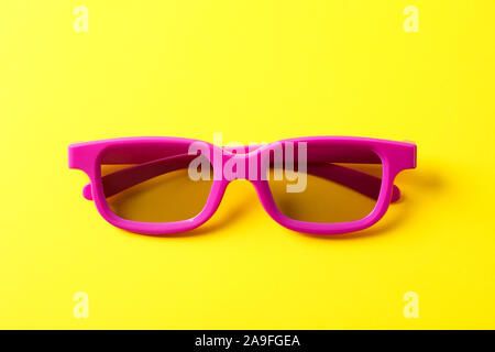 3d glasses on yellow background, close up Stock Photo