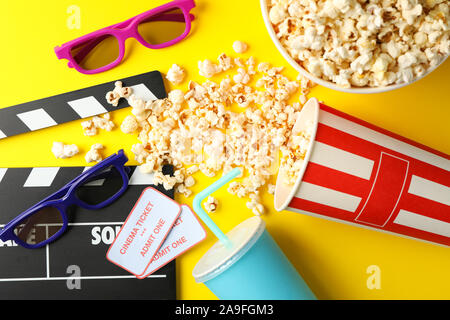 Flat lay composition with movie watching accessories on yellow background Stock Photo