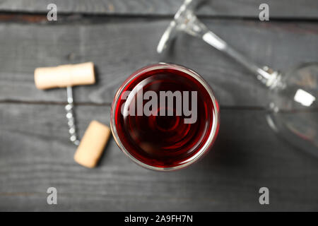 Flat lay composition with wine glasses, corkscrew and cork on wooden background, closeup Stock Photo