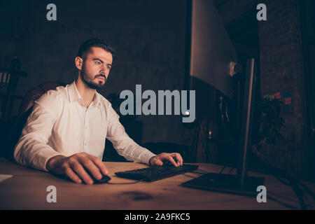 Photo of entrepreneur in thoughts looking pensively into screen in search of consistant patterns browsing through different websites Stock Photo
