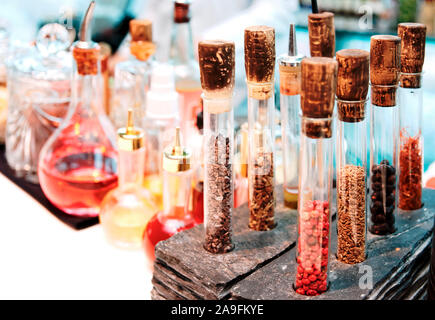 Spices and bitters on bar counter, toned Stock Photo