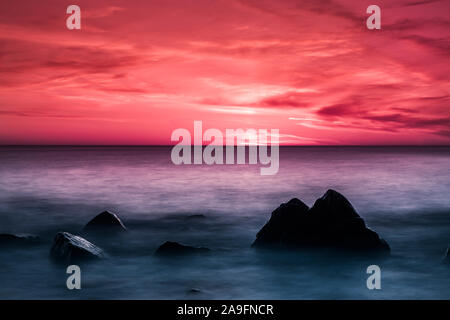 Colorful sunset at the sea with horizon over the water Stock Photo