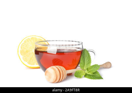 Cup of tea, lemon, mint and dipper isolated on white background Stock Photo