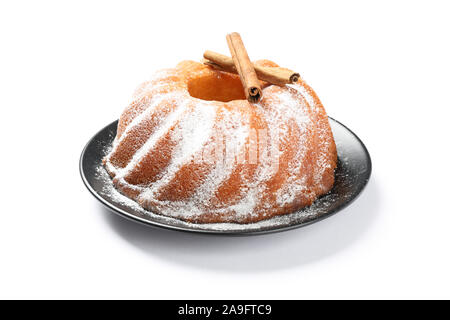 Cake with powder sugar and cinnamon isolated on white background Stock Photo