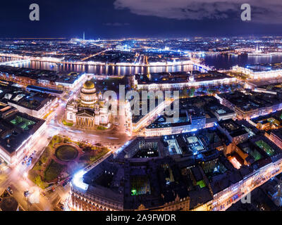 Night aerial panoramic view in Saint Petersburg, Russia. Illuminated st Isaac cathedral, Neva river, bridges and Peter and Paul fortress Stock Photo
