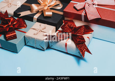 Holiday composition. Various handmade gift boxes on pastel blue background. Birthday concept. Flat lay, top view, copy space Stock Photo