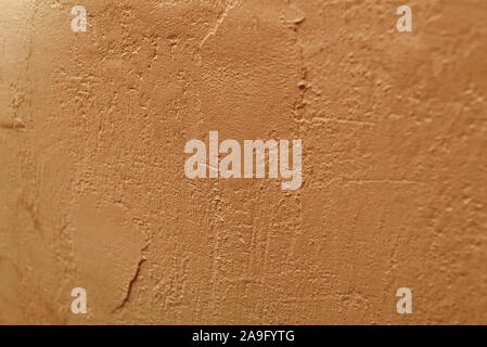 concrete wall background. Beige wall texture. Beige or yellow wall texture. Material for designers. Background of cement painted. Putty wall painted i Stock Photo