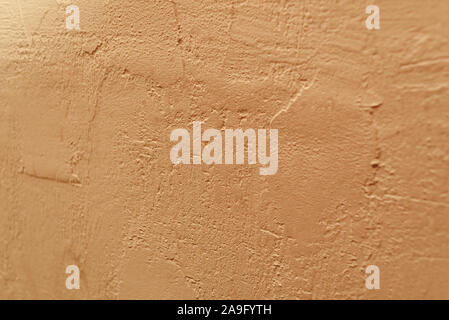 concrete wall background. Beige wall texture. Beige or yellow wall texture. Material for designers. Background of cement painted. Putty wall painted i Stock Photo