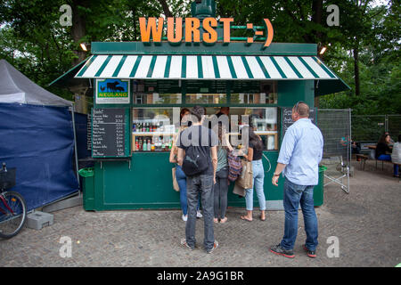 Home-made sauces and a fresh and tasty sausage or currywurst make people stand in line in front of a Imbiss, Germany Stock Photo