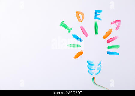 Drawn light bulb and inscription Idea on white background, space for text Stock Photo