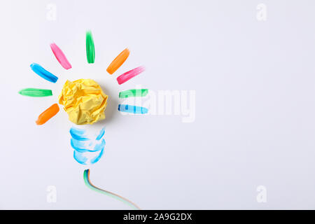 Drawn light bulb and paper ball on white background, space for text Stock Photo