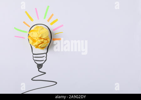 Drawn light bulb and paper ball on white background. Good idea concept Stock Photo