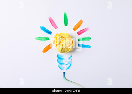 Drawn light bulb and paper ball on white background, space for text Stock Photo